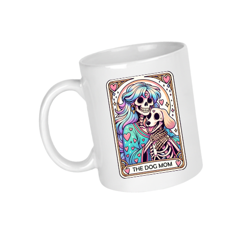 White mug with a colorful design of a skeleton and dog, labeled 'The Dog Mom', on a white background.