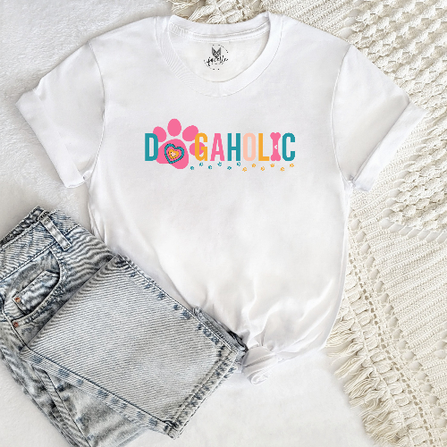 White t-shirt with 'DOGAHOLIC' text and jeans on a textured surface