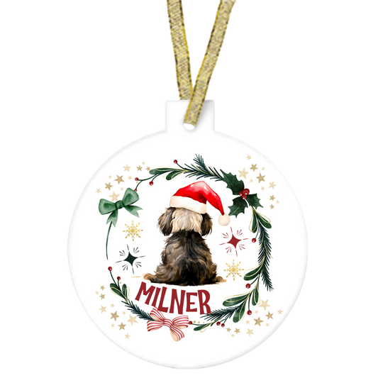 Christmas ornament with a dog wearing a Santa hat and the name 'Milner'.
